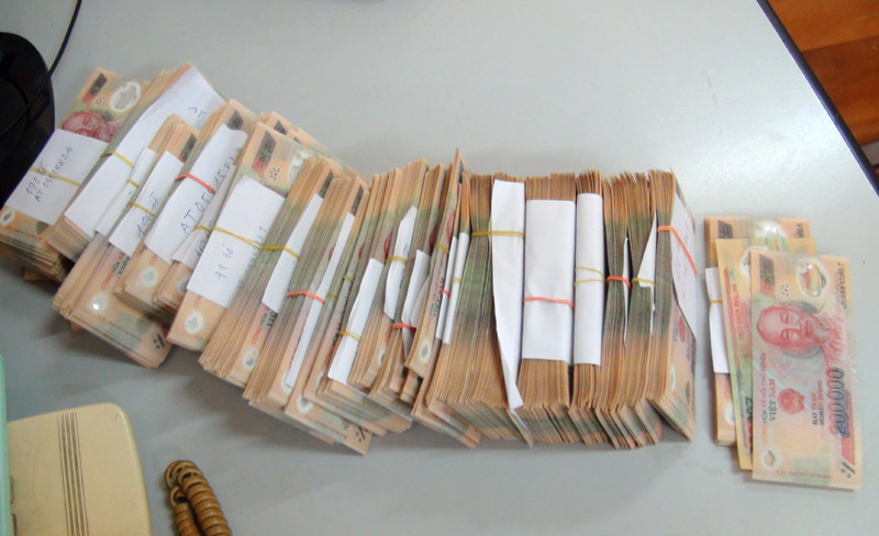 Số tiền giả của các đối tượng bị thu giữ. Ảnh: Tuấn Nguyễn. Số tiền giả của các đối tượng bị thu giữ. Ảnh: Tuấn Nguyễn