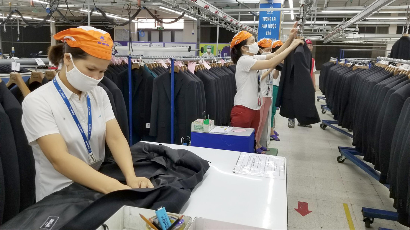 Công nhân và doanh nghiệp gặp khó khăn đang rất cần được hỗ trợ Ảnh minh họa: Phạm Thanh