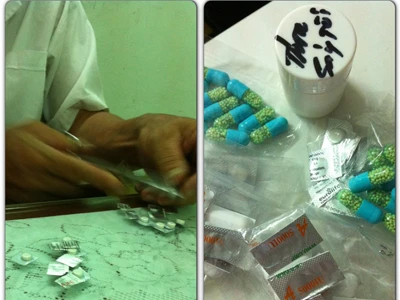 Bác sĩ Nguyễn Xuân Ng. ở phòng khám tư dùng kéo cắt thuốc không nguồn gốc bán lẻ cho bệnh nhân. Ảnh: L.N 