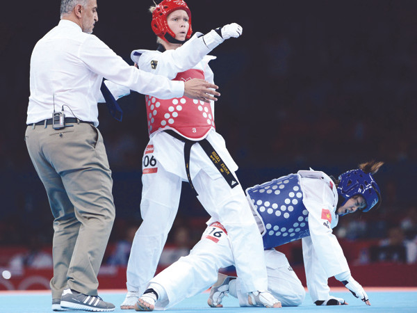 Taekwondo VN (trong ảnh là võ sỹ Diệu Linh, phải) được cho là đã được đầu tư khoảng 200.000 USD nhưng đổi lại là thất bại nặng nề tại Olympic London 2012. Ảnh: Quang Thắng