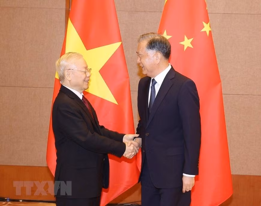 Hình ảnh Tổng Bí thư Nguyễn Phú Trọng và Chủ tịch Chính hiệp Trung Quốc Uông Dương. (Ảnh: Trí Dũng/TTXVN)