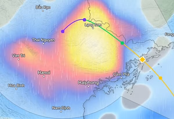 Dự báo mưa diện rộng ở miền Bắc vào sáng mai, 23/7, khi bão số 2 đổ bộ (những vùng màu xanh da trời là mưa nhỏ đến vừa, màu đỏ là mưa vừa đến mưa to, màu vàng đến trắng là mưa rất to). Ảnh: Zoom Earth, OpenStreetMap.