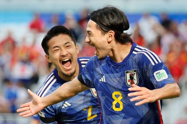 Minamino 2 lần lập công cho ĐT Nhật Bản trong trận đấu với ĐT Việt Nam. Ảnh: AFP-JIJI. Minamino 2 lần lập công cho ĐT Nhật Bản trong trận đấu với ĐT Việt Nam. Ảnh: AFP-JIJI.