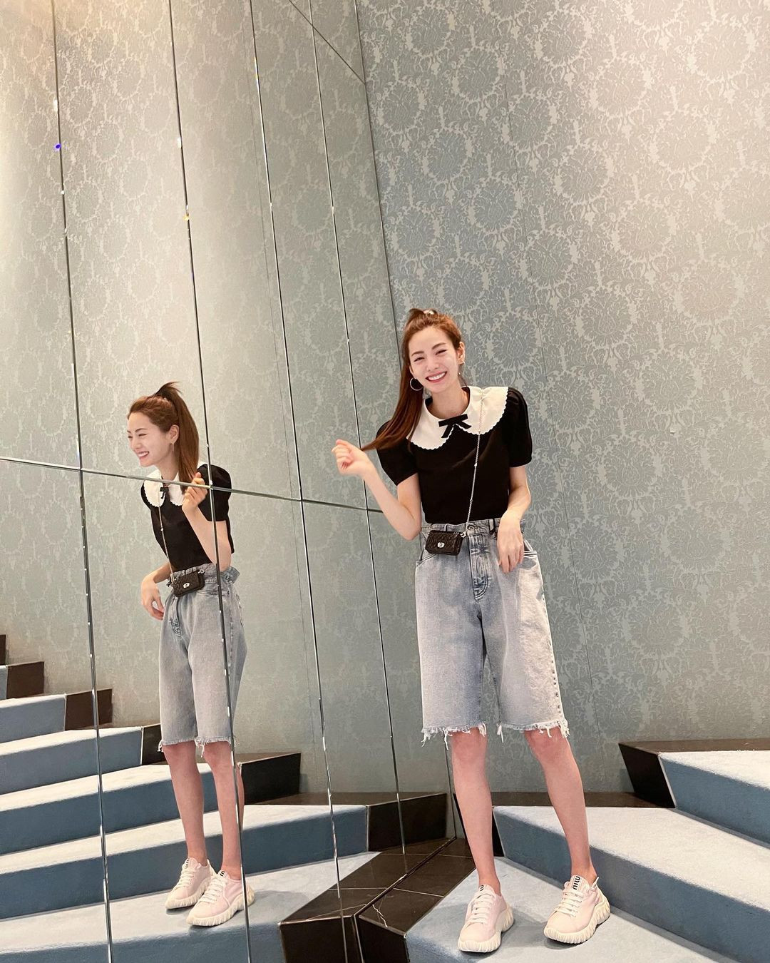 Mỹ nhân bắt trend quần lửng, phá cách phối với áo bánh bèo cùng túi xách tí hon.