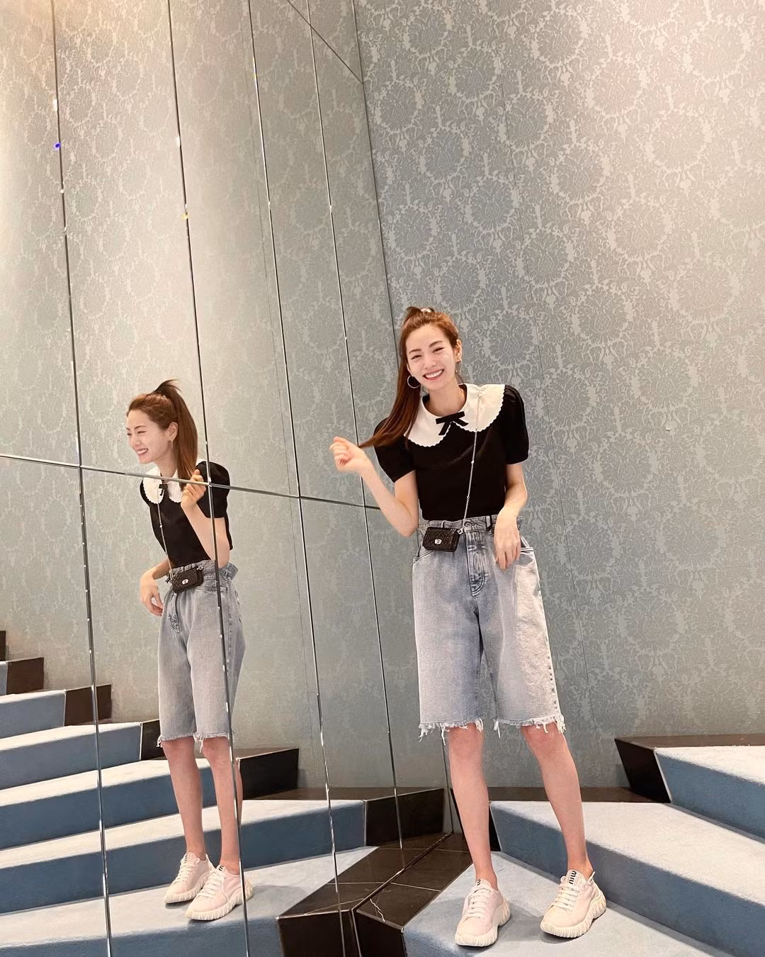 Mỹ nhân bắt trend quần lửng, phá cách phối với áo bánh bèo cùng túi xách tí hon.