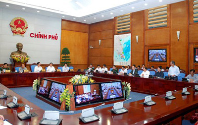 Giám đốc Trung tân Dự báo KTTV TƯ Bùi Minh Tăng (người đứng trong ảnh) báo cáo diễn biến bão Haiyan. Ảnh: VGP/Nhật Bắc