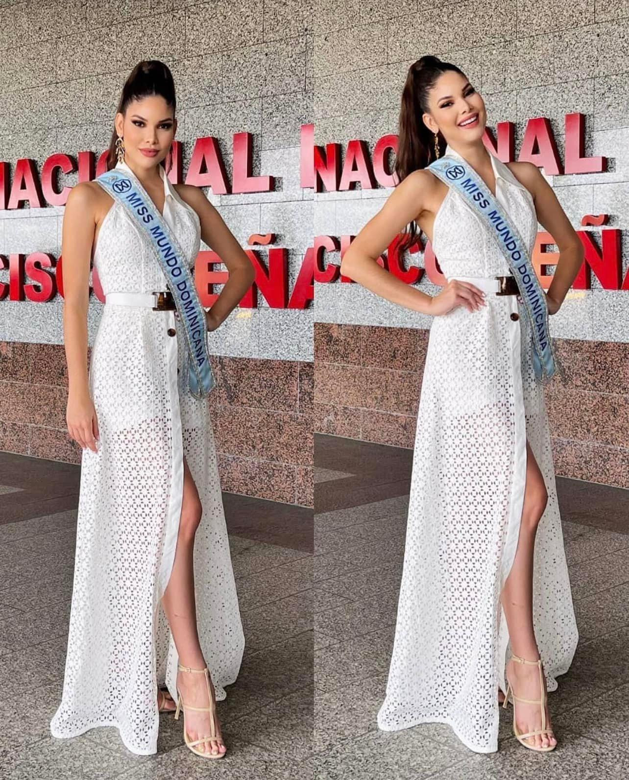 Hoa hậu CH Dominica diện váy ren trắng xẻ tà quyến rũ ở sân bay.