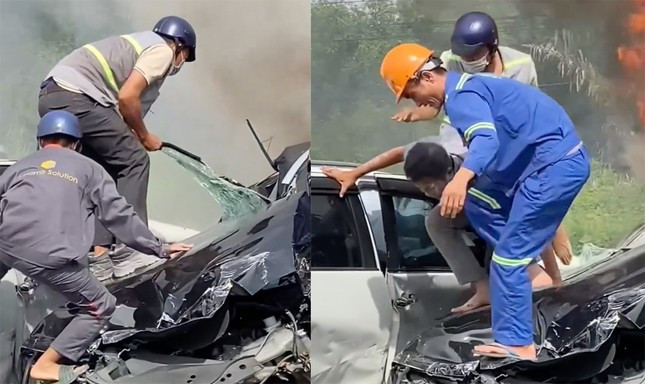 Nhóm công nhân giải cứu tài xế mắc kẹt trong ô tô biến dạng sau tai nạn liên hoàn. Ảnh cắt từ clip.