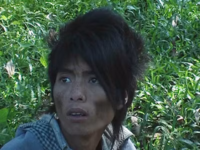 Nét mặt "người rừng" Đinh Văn Huy vẫn chưa hết nỗi kinh hoàng. Ảnh: Khoa học Đời sống. Nét mặt