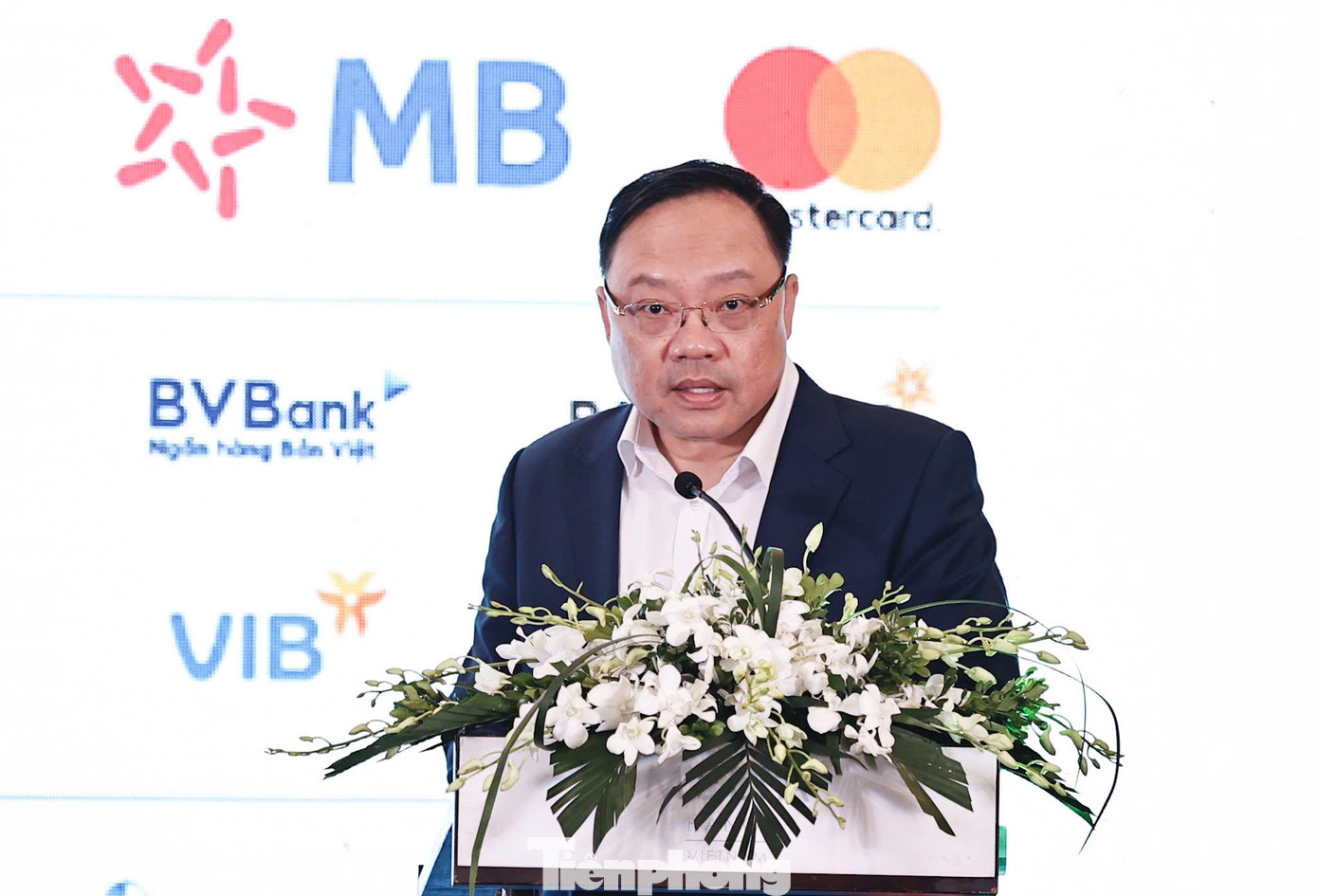 Ông Phạm Anh Tuấn - Vụ trưởng Vụ Thanh toán (Ngân hàng Nhà nước) - phát biểu tại họp báo.