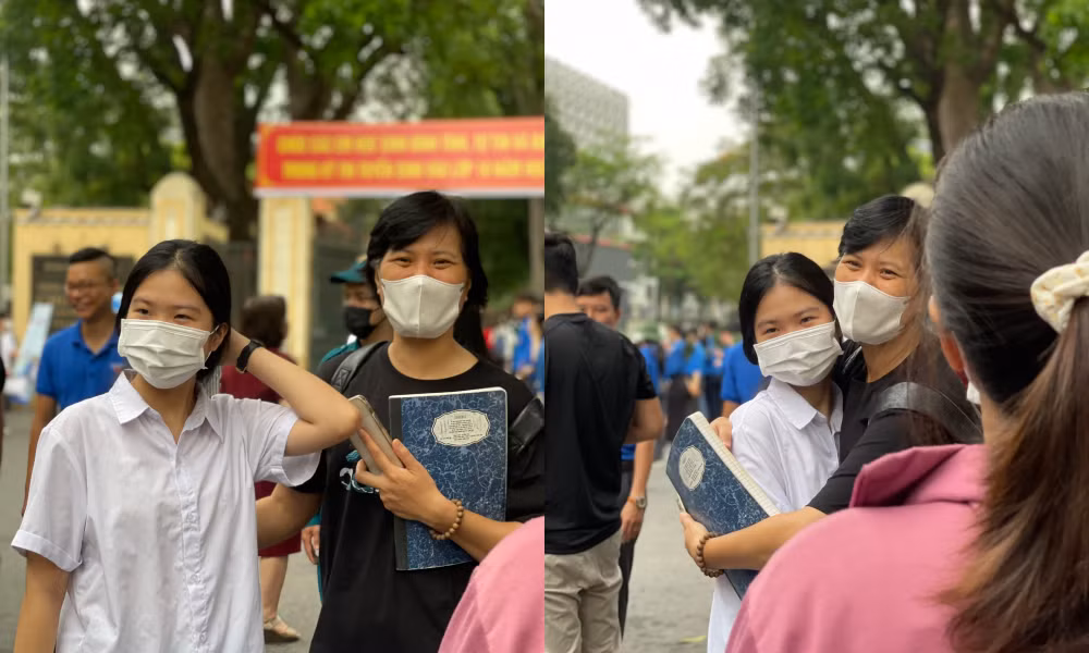 Tại điểm thi trường THPT Chu Văn An (Hà Nội), trước khi con bước vào phòng thi, nhiều phụ huynh nắm tay, quàng vai, trao những cái ôm động viên, khích lệ tinh thần các con. Phần lớn phụ huynh đều hồi hộp không kém các sĩ tử. (Ảnh: Hiền Vũ)