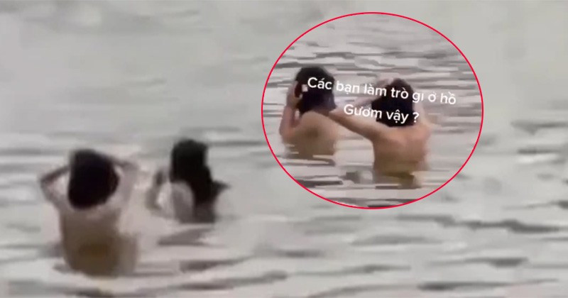 Hình ảnh 2 người tắm ở hồ Hoàn Kiếm trong đoạn clip được chia sẻ trên mạng xã hội. Hình ảnh 2 người tắm ở hồ Hoàn Kiếm trong đoạn clip được chia sẻ trên mạng xã hội.