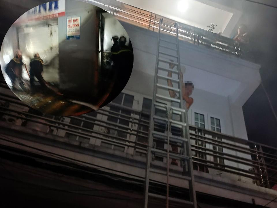 Lực lượng PCCC&CNCH chữa cháy và người dân thoát ra ngoài bằng thang. Lực lượng PCCC&CNCH chữa cháy và người dân thoát ra ngoài bằng thang.