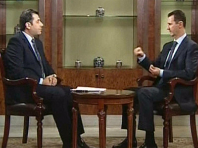 Tổng thống Syria Assad (phải) đang trả lời phỏng vấn của Al Dunya TV. Ảnh: Ria-Novosti