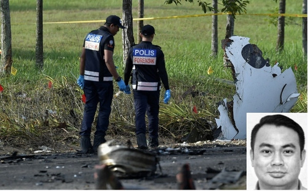 Cảnh sát ở hiện trường và phi công Roslan (ảnh nhỏ). Ảnh: Bernama. Cảnh sát ở hiện trường và phi công Roslan (ảnh nhỏ). Ảnh: Bernama.