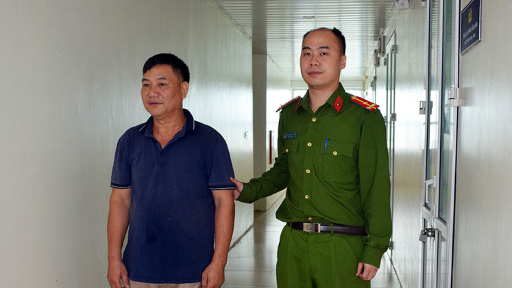 Bị can Nguyễn Ngọc Hưng tại cơ quan công an.