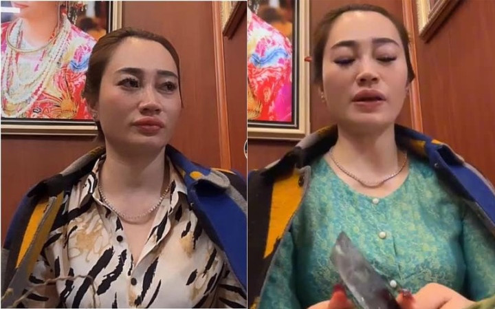 Cô đồng quê Hải Dương vừa bổ cau vừa xem bói. Ảnh: Cắt từ clip