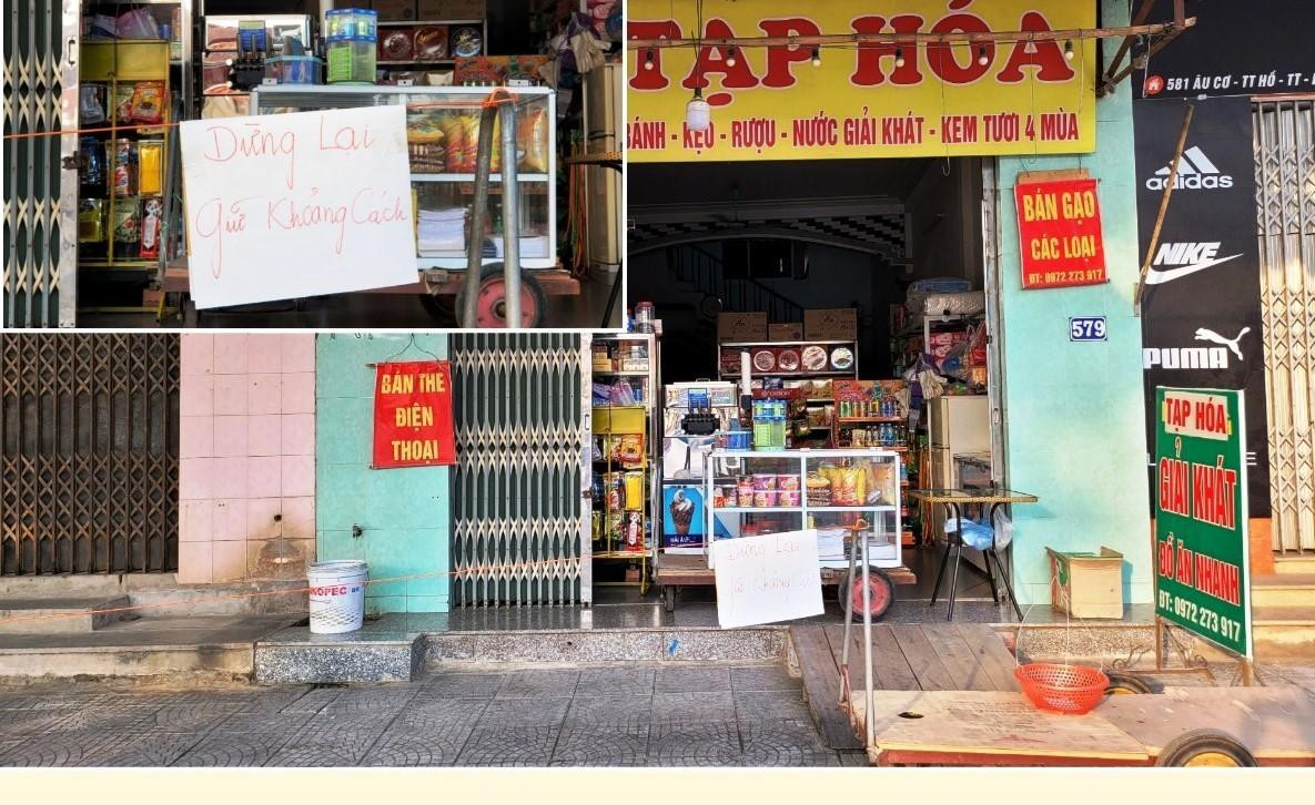 Một số gia đình đã tự áp dụng biện pháp phòng dịch. Trong ảnh, một hàng tạp hoá lập rào chắn, yêu cầu khách hàng đảm bảo khoảng cách.