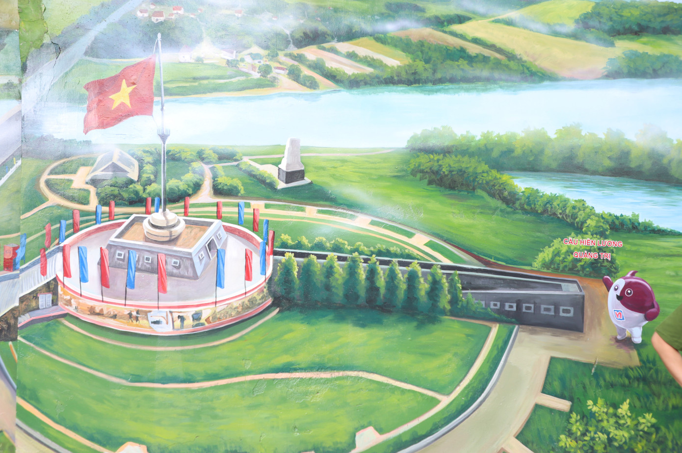 Nơi thực hiện công trình bích họa Việt Nam tươi đẹp thứ 19 là vị trí trọng điểm, vẽ trên bức tường bao phía trước Phòng Cảnh sát cơ động, dọc theo hai tuyến đường Đinh Tiên Hoàng và Nguyễn Thị Minh Khai (phường Đa Kao, quận 1), nằm trong khu vực diễu binh, diễu hành kỷ niệm 50 năm Ngày Giải phóng miền Nam, thống nhất đất nước.