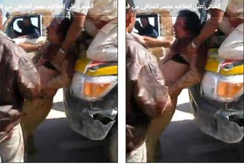 Ông Gaddafi bị kéo lên nắp ca pô một chiếc xe. Ông Gaddafi bị kéo lên nắp ca pô một chiếc xe