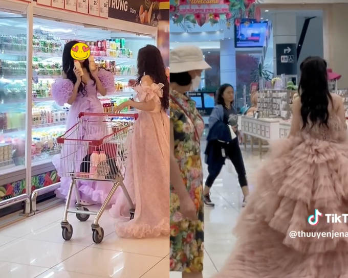 Những cô gái mặc váy công chúa đi siêu thị thu hút sự chú ý của mọi người xung quanh. (Ảnh: Chụp màn hình)