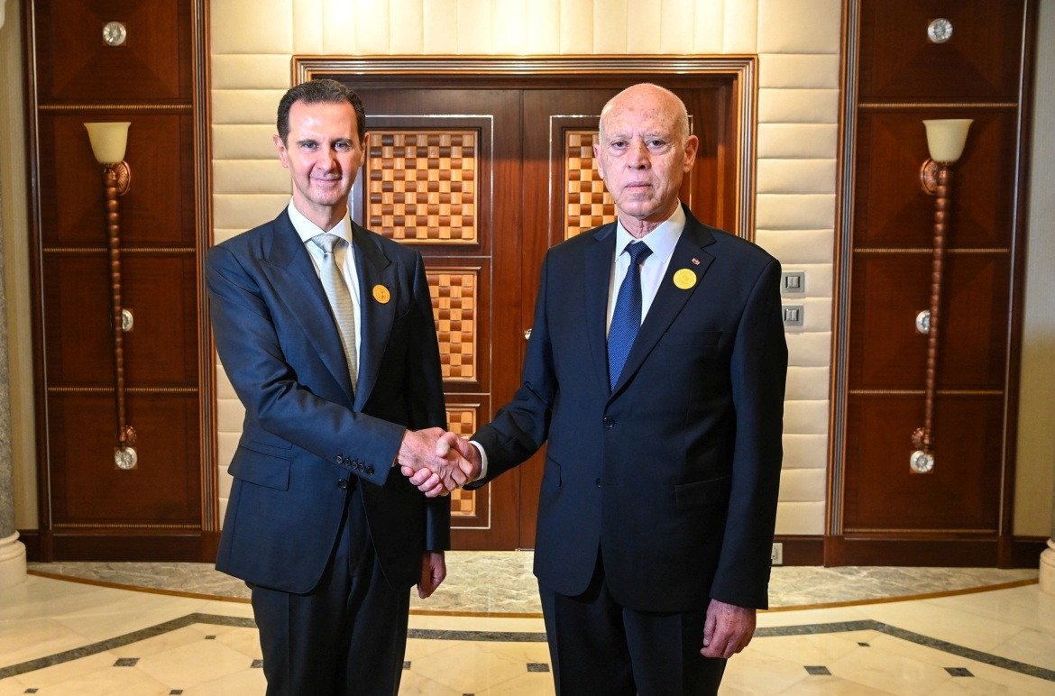 Ông Assad và Tổng thống Tunisia - Kais al-Saied. Ảnh: Reuters