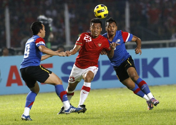 Indonesia (áo đỏ) rất nỗ lực nhưng không thể lật ngược tỉ số chung cuộc