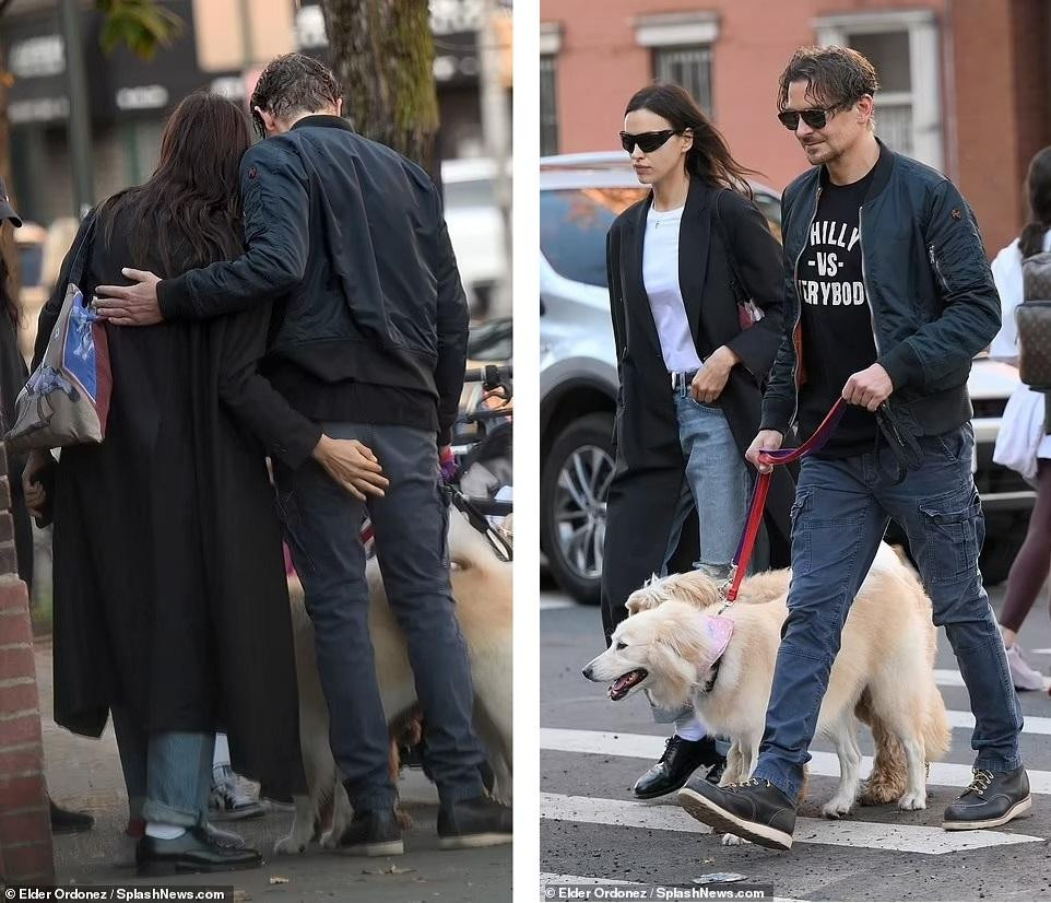 Cánh săn ảnh chụp được khoảnh khắc hai ngôi sao ôm ấp nơi công cộng. Siêu mẫu Nga còn đặt "bàn tay" lên vòng ba của tài tử A Star Is Born. Ảnh: SplashNews.com.