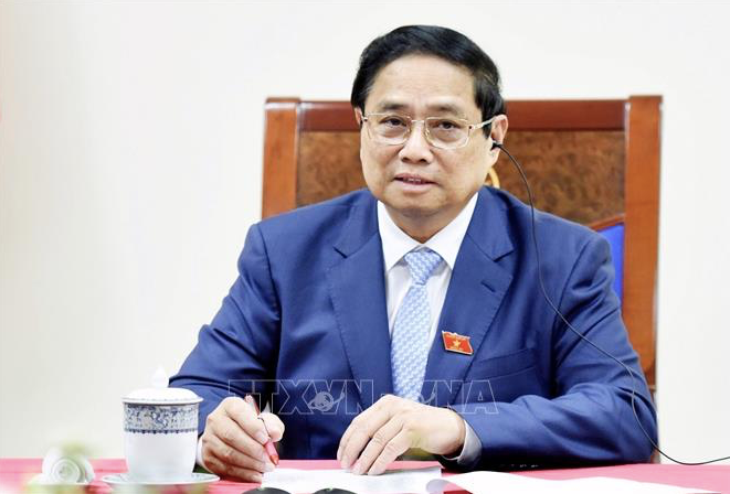 Thủ tướng Phạm Minh Chính trong cuộc điện đàm với Thủ tướng Singapore Lawrence Wong. (Ảnh: VNA) Thủ tướng Phạm Minh Chính trong cuộc điện đàm với Thủ tướng Singapore Lawrence Wong. (Ảnh: VNA)