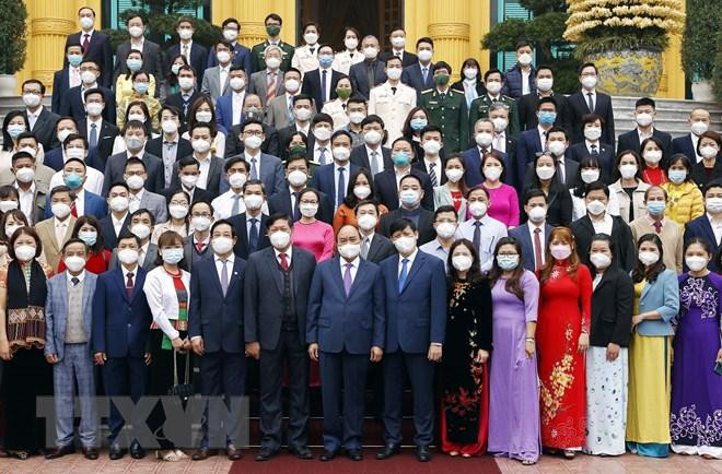Chủ tịch nước Nguyễn Xuân Phúc và các đại biểu. (Ảnh: Thống Nhất/TTXVN)