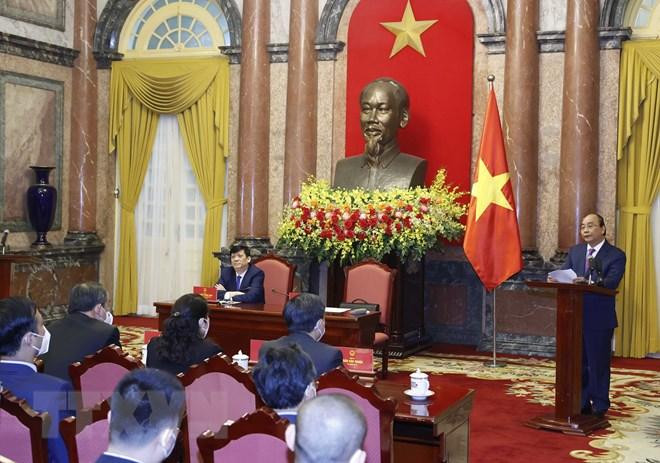 Chủ tịch nước Nguyễn Xuân Phúc phát biểu tại buổi gặp mặt. (Ảnh: Thống Nhất/TTXVN)