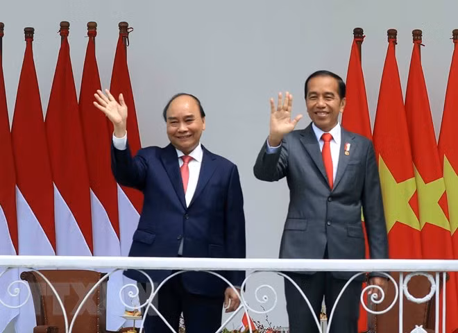 Chủ tịch nước Nguyễn Xuân Phúc và Tổng thống nước Cộng hòa Indonesia Joko Widodo. (Ảnh: Thống Nhất/TTXVN).