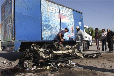 Hiện trường một trong 14 vụ đánh bom ở khu vực thủ đô Baghdad và vùng ngoại ô của Iraq trong ngày 30/9. Hiện trường một trong 14 vụ đánh bom ở khu vực thủ đô Baghdad và vùng ngoại ô của Iraq trong ngày 30/9