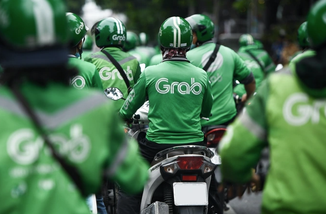 Trước làn sóng sa thải, không ít tài xế xe ôm công nghệ tỏ ra không quá lo lắng (Ảnh minh họa: Grab). Trước làn sóng sa thải, không ít tài xế xe ôm công nghệ tỏ ra không quá lo lắng (Ảnh minh họa: Grab).