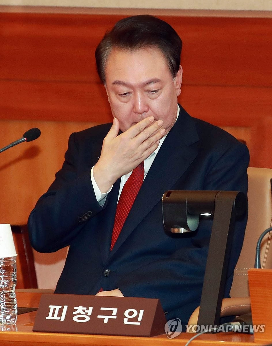 Tổng thống Yoon tại phiên điều trần chiều 21/1. (Ảnh: Yonhap)