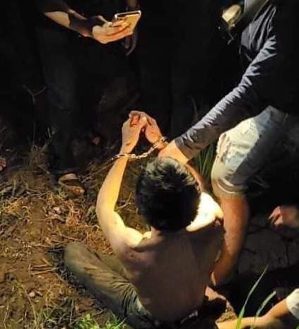 Nghi phạm Phan Danh Hưng bị công an bắt khi đang lẩn trốn trên núi. Ảnh: CTV.