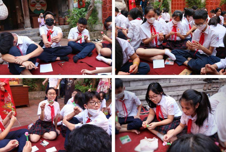 Nhiều tò he hình hoa hồng với đa dạng màu sắc được tween Nguyễn Du tạo ra theo hướng dẫn của nghệ nhân.