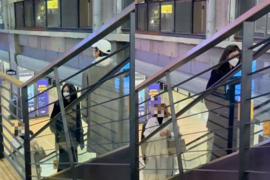 Song Joong Ki và Katy Louise Saunders đeo khẩu trang và ăn vận giản dị. - Ảnh: Money Today Song Joong Ki và Katy Louise Saunders đeo khẩu trang và ăn vận giản dị. - Ảnh: Money Today