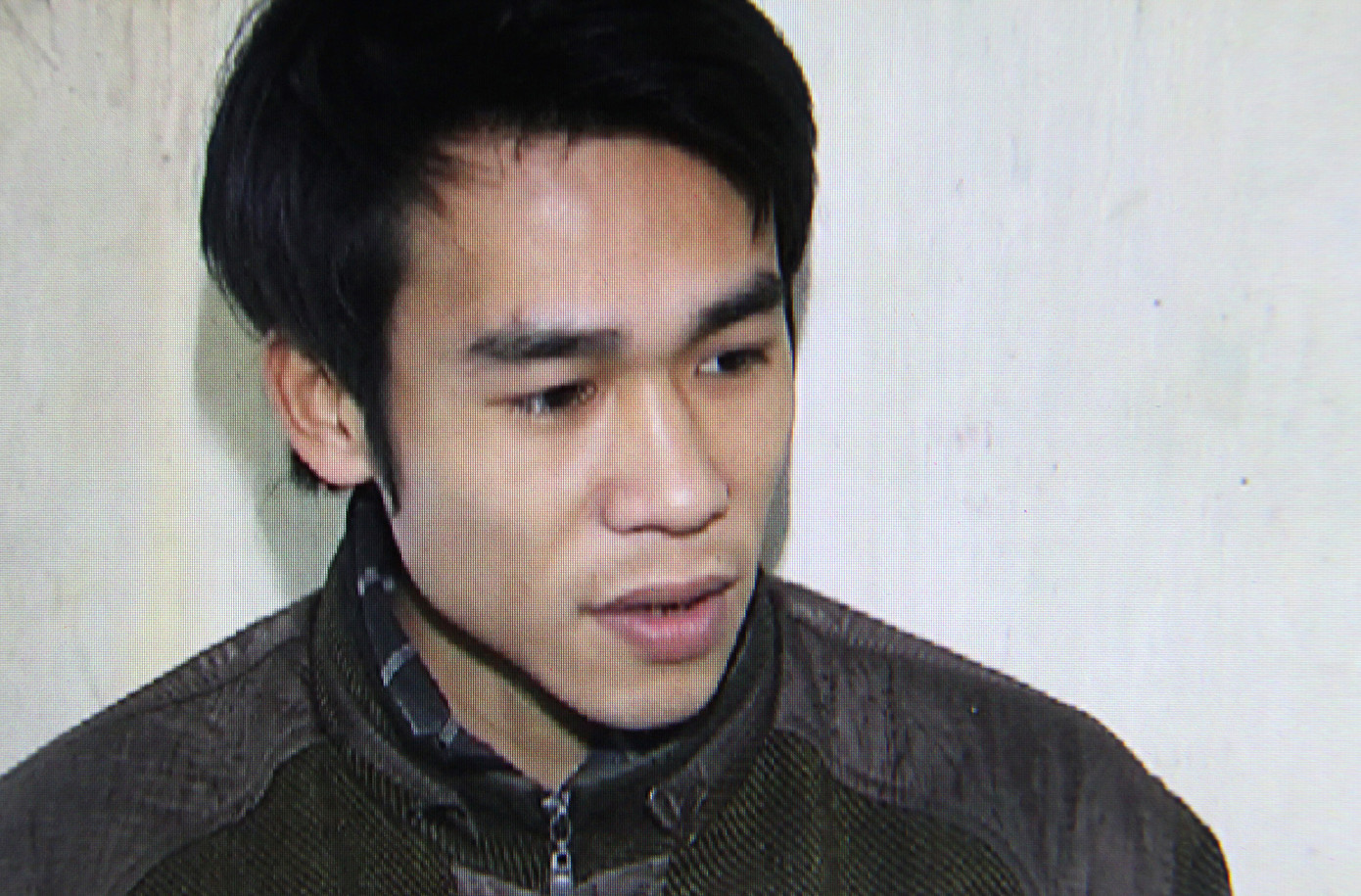 Hung thủ Nguyễn Hữu Dưỡng tại cơ quan điều tra