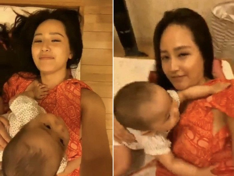 Nàng hậu chơi đùa vui vẻ với em bé trong video. Nàng hậu chơi đùa vui vẻ với em bé trong video.