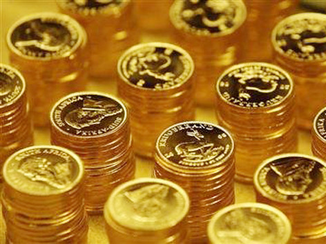 Các chuyên gia nhận định vàng có thể tiếp tục giảm về 1.100 USD/Oz. Ảnh: Reuters