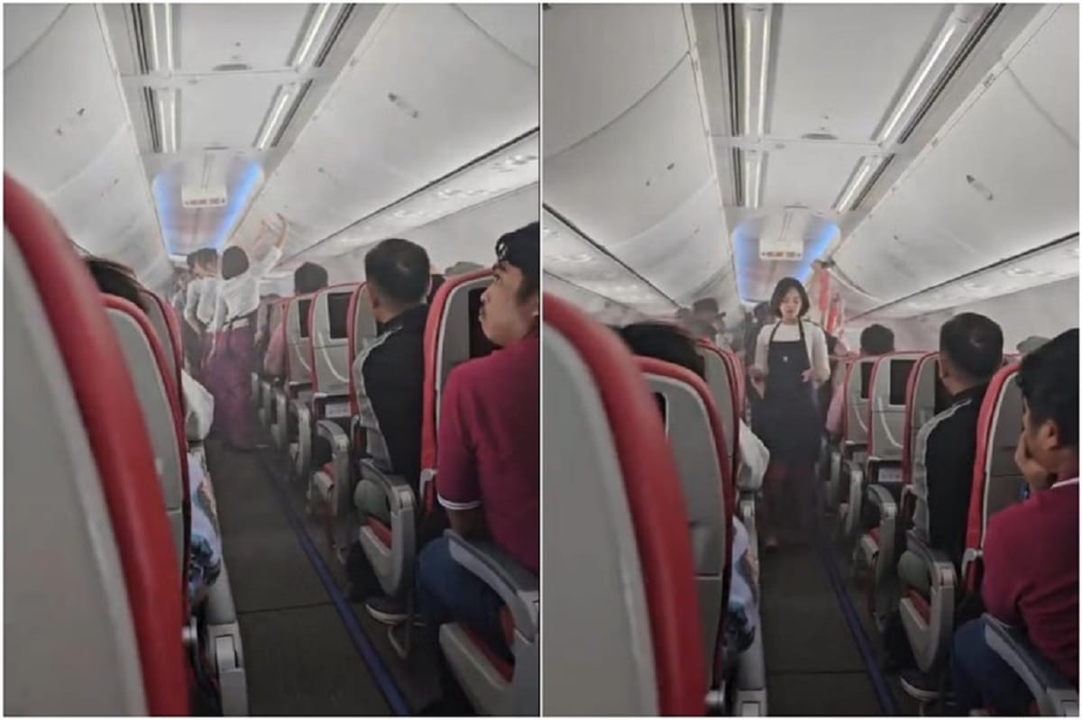 Tiếp viên hàng không dập tắt nguồn khói trên chuyến bay của Batik Air. Ảnh: Kentmaherr/TikTok. Tiếp viên hàng không dập tắt nguồn khói trên chuyến bay của Batik Air. Ảnh: Kentmaherr/TikTok.