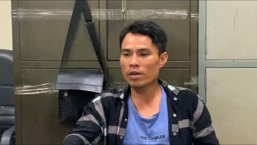 Đối tượng Đoàn Minh Hải làm việc với công an tại TP.HCM. Ảnh công an cung cấp.