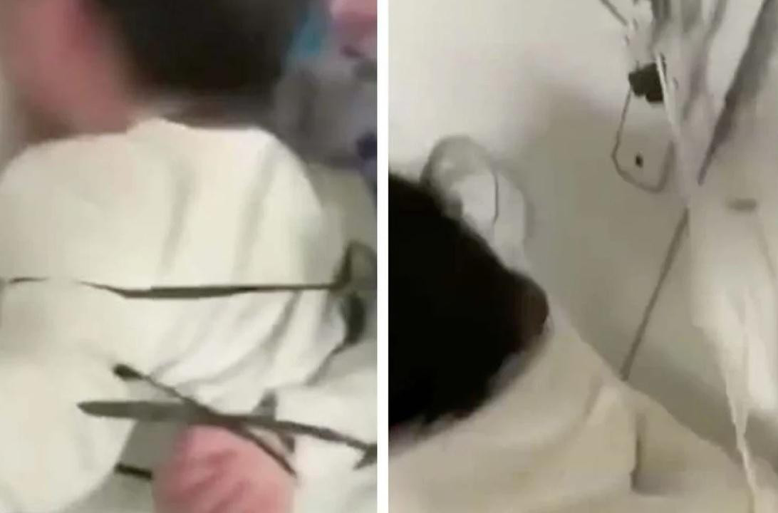 Hình ảnh hai đứa trẻ bị trói tay sau lưng trong video được đưa lên mạng xã hội