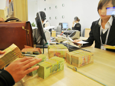 Kinh tế có triển vọng nhưng tiền được dự báo mất giá. Ảnh: Hồng Vĩnh. Kinh tế có triển vọng nhưng tiền được dự báo mất giá. Ảnh: Hồng Vĩnh