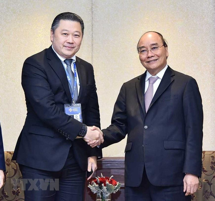 Chiều 17/11, tại thủ đô Bangkok (Thái Lan), Chủ tịch nước Nguyễn Xuân Phúc tiếp Chủ tịch Tập đoàn CP Dhanim Chearnont. (Ảnh: Thống Nhất/TTXVN)