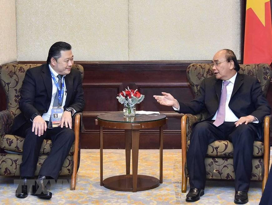 Chiều 17/11, tại thủ đô Bangkok (Thái Lan), Chủ tịch nước Nguyễn Xuân Phúc tiếp Chủ tịch Tập đoàn CP Dhanim Chearnont. (Ảnh: Thống Nhất/TTXVN)