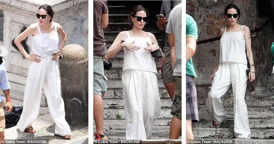 Minh tinh 7x mặc bộ đồ giản dị và thoải mái màu trắng, gồm áo hai dây và quần ống rộng. Minh tinh 7x mặc bộ đồ giản dị và thoải mái màu trắng, gồm áo hai dây và quần ống rộng.