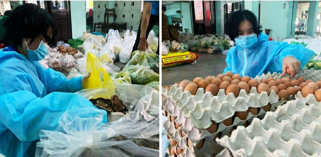 Hai chị em sinh đôi là sinh viên năm nhất trường Đại học Kinh tế - Luật xung phong trở thành tình nguyện viên mùa dịch. (Ảnh: Đại học Quốc gia TP.HCM)