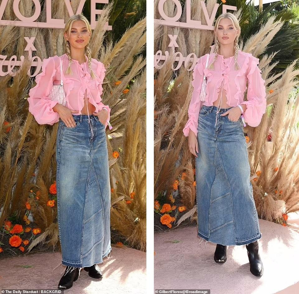 Người đẹp Thụy Điển Elsa Hosk mặc áo xuyên thấu bèo nhún màu hồng "quên" nội y, chân váy jean dáng dài, boot đen mũi nhọn.
